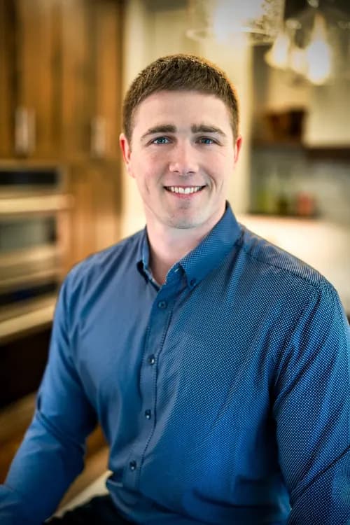 Professional seated in an office for a people-centered business portrait