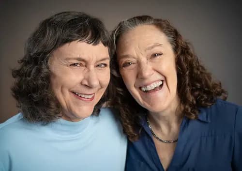 Two colleagues sharing a natural, connected professional portrait
