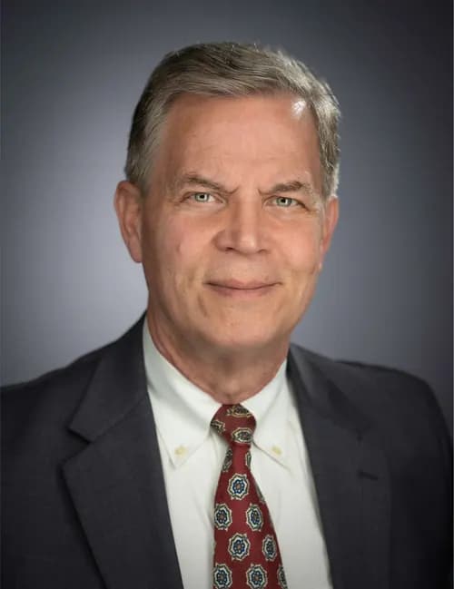 Consistent company headshot for a leadership profile