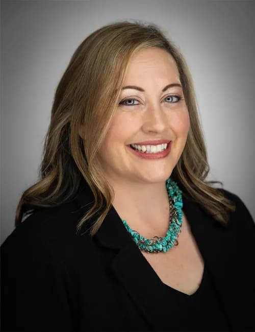Strong professional studio portrait for a project manager