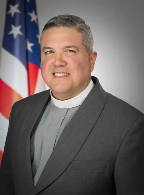 Formal clergy studio portrait for community and church communications