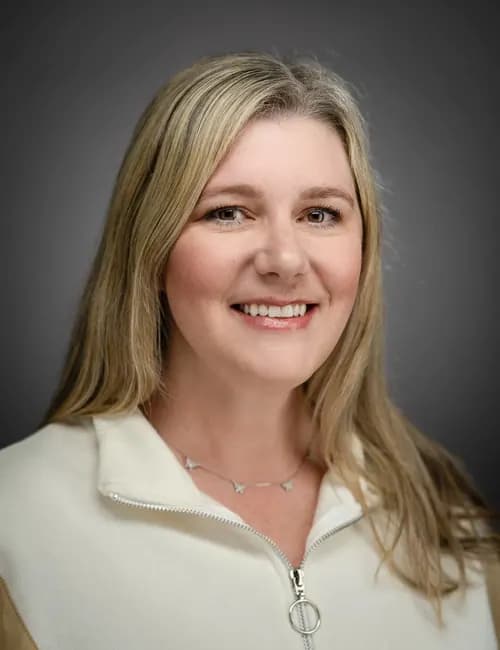 Confident professional studio portrait for a renewable-energy professional