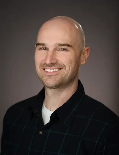Clear professional studio portrait for a public information officer