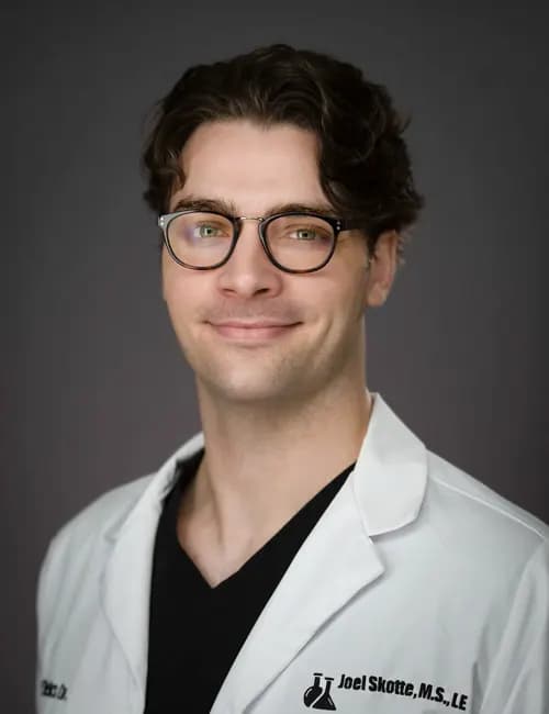 Composed professional studio portrait for an event producer