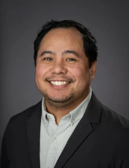 Capable professional studio portrait for a procurement specialist
