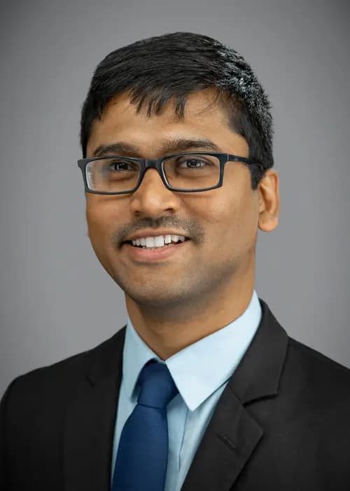 Confident professional studio portrait for a client success leader