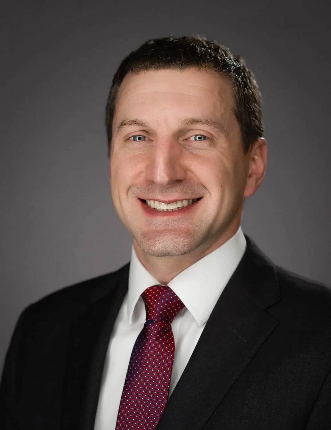 Board-ready professional studio portrait for a civic or nonprofit director